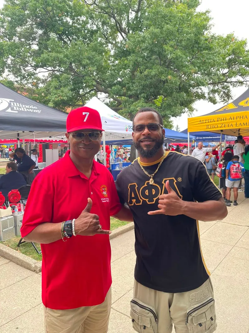 Miguel Jones with Chris Welch at an outdoor community event