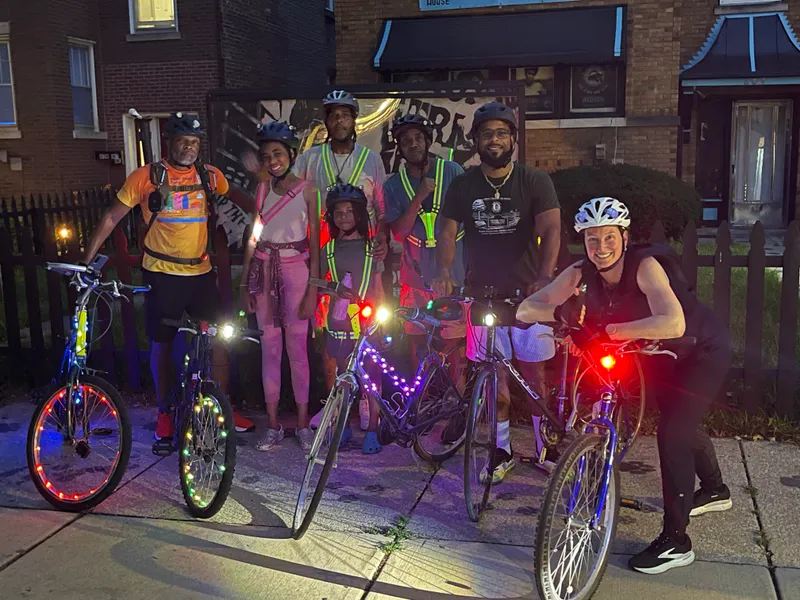 Group bike ride at night with lit-up bicycles