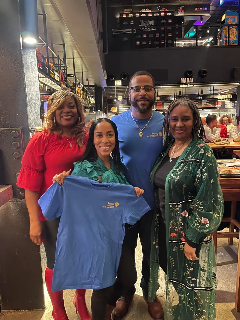 Miguel Jones with Rotary Club members